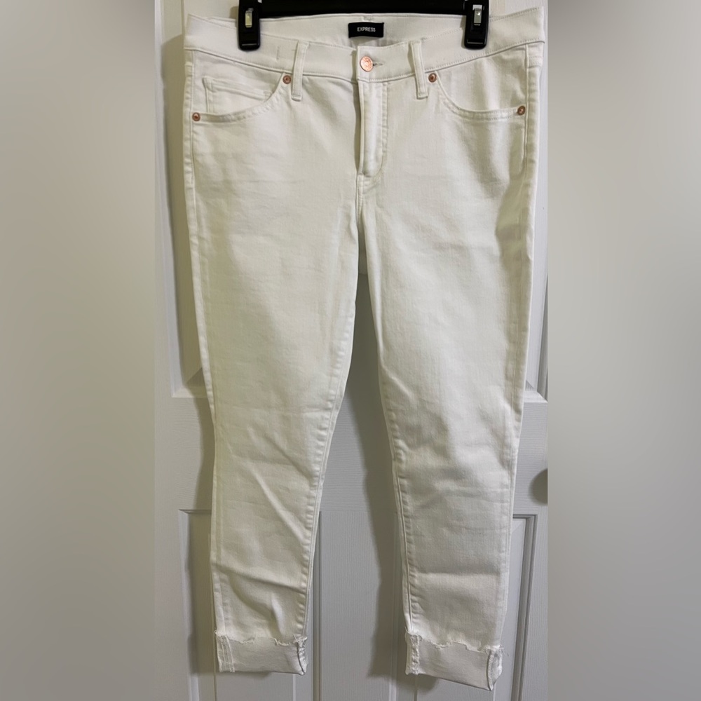 Express white skinny raw hem shiny jeans